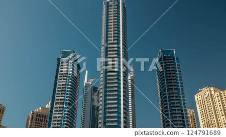 Close up view of Dubai Marina towers in Dubai at day time timelapse hyperlapse Close up view of Dubai Marina towers in Dubai at day time timelapse hyperlapse 124791689