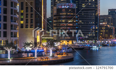 Dubai Marina towers and canal in Dubai day to night timelapse 124791700
