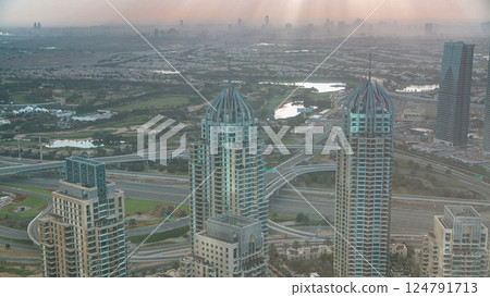Morning in Dubai Marina with towers and traffic on road from skyscraper, Dubai, UAE timelapse 124791713