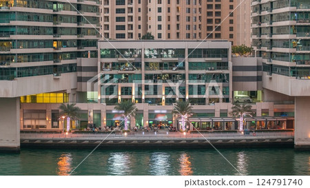 Dubai Marina towers and canal in Dubai day to night timelapse 124791740