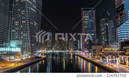 Promenade and canal in Dubai Marina timelapse at night, UAE. 124791759