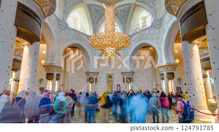 Magnificent interior of Sheikh Zayed Grand Mosque timelapse hyperlapse with crowd in Abu Dhabi. 124791785