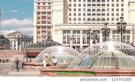 Manezh Square with fountains timelapse in Moscow. Moscow Hotel on background. Manezh Square with fountains timelapse in Moscow. Moscow Hotel on background. 124791805