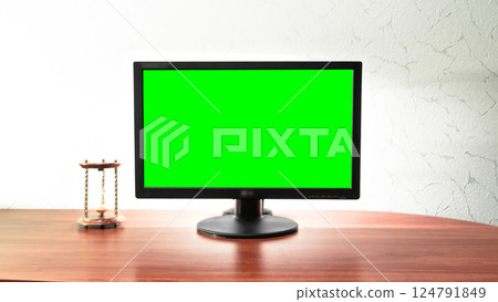 Computer green screen monitor is standing on a desk in an office timelapse hyperlapse. 124791849