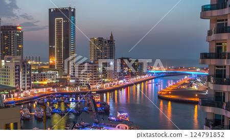 An Aerial view of Dubai Marina towers in Dubai day to night timelapse An Aerial view of Dubai Marina towers in Dubai day to night timelapse 124791852