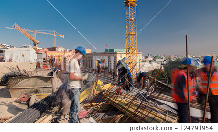 Steel bar rebar metal framework reinforcement for concrete at construction site timelapse. 124791954