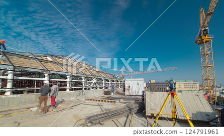 Construction worker using theodolite surveying optical instrument timelapse. Construction worker using theodolite surveying optical instrument timelapse. 124791961