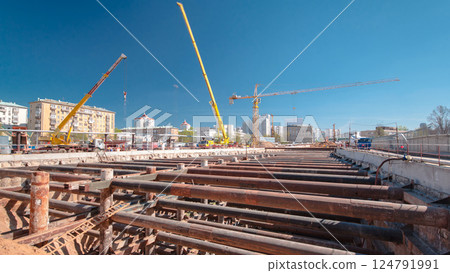 A large huge ditch pit tunnel timelapse at the construction site of the underground metro station line. 124791991