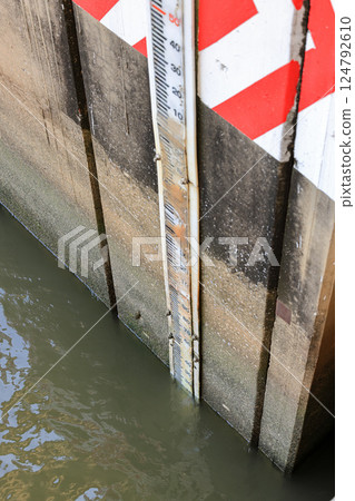 Water level indicator on reinforcement concrete wall of Watergate for water management support agriculture.  124792610