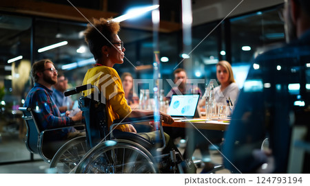 Wheelchair user giving a presentation to colleagues in a boardroom, confident and professional, diverse team, modern office 124793194