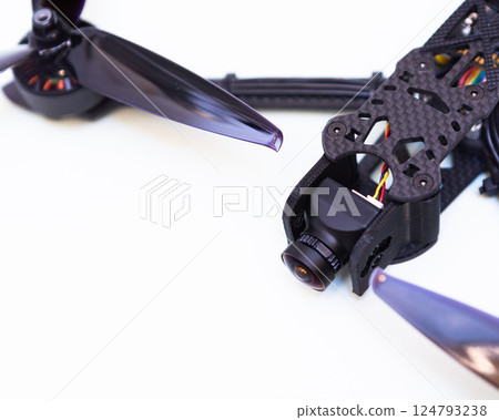 FPV drone in production on white background. FPV drone in production on white background. 124793238