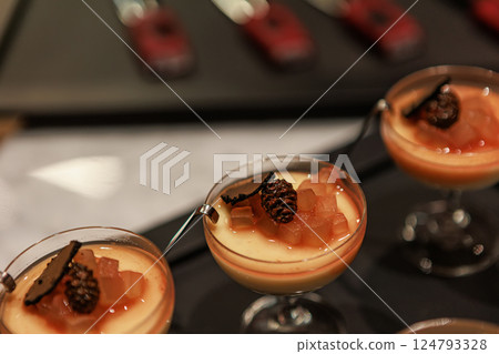 Elegant gourmet dessert served in delicate glassware Elegant gourmet dessert served in delicate glassware 124793328