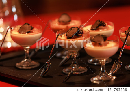 Elegant gourmet dessert served in delicate glassware Elegant gourmet dessert served in delicate glassware 124793338