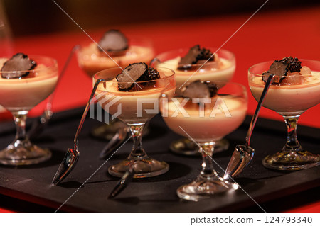 Elegant gourmet dessert served in delicate glassware Elegant gourmet dessert served in delicate glassware 124793340