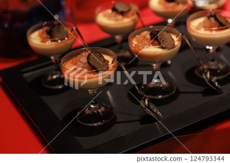 Elegant gourmet dessert served in delicate glassware Elegant gourmet dessert served in delicate glassware 124793344