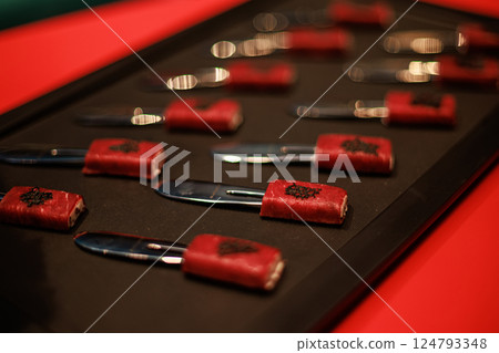 Exquisite gourmet appetizer featuring delicate slices of raw beef wrapped around a creamy filling 124793348
