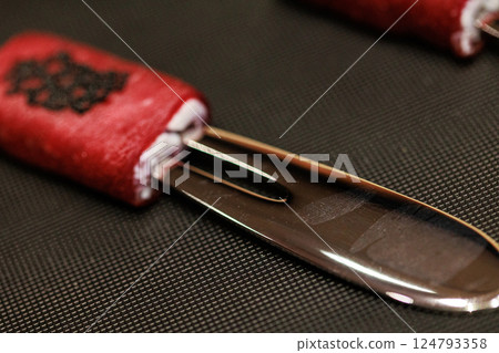 Exquisite gourmet appetizer featuring delicate slices of raw beef wrapped around a creamy filling Exquisite gourmet appetizer featuring delicate slices of raw beef wrapped around a creamy filling 124793358