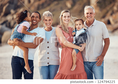 Interracial family, beach smile and children together on a bonding with happiness and kid care. Portrait of a happy, vacation and parents with senior grandparents holding kids with love outdoor 124794225