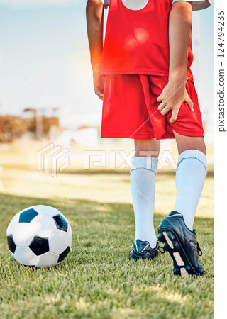 Fitness, soccer kid or hamstring pain on soccer field for workout exercise, training or football training match. Health, wellness or injured soccer player for muscle injury, leg or medical emergency 124794235