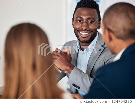 Corporate, smile and black man in a meeting with management for business, planning and strategy. Teamwork, business meeting and African businessman talking to employees about an idea for company 124794250
