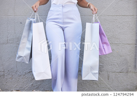 Customer, shopping and bags with sale, discount and retail therapy in city. Female client, lady shopper and consumer on shopping spree, purchases and elegant for boutique items and designer clothes. 124794294