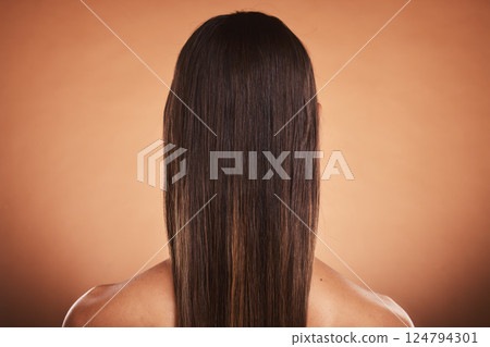 Brunette woman, shine and hair care, beauty salon, balayage and hair dye, color cosmetics and wig extension on studio orange background. Back of head, scalp and long hair style with smooth texture 124794301