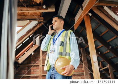 Engineering, phone call and man at a construction site working on an architectural project. Smartphone, architecture and industry worker on a mobile conversation while doing maintenance on a building Engineering, phone call and man at a construction site working on an architectural project. Smartphone, architecture and industry worker on a mobile conversation while doing maintenance on a building 124794344