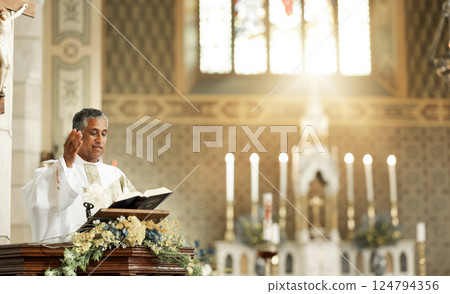 Pastor on church podium praying for bible prayer, worship or leadership for trust to god spiritual priest speech. Motivation, hope or support from man reading for religion, faith or holy gospel 124794356