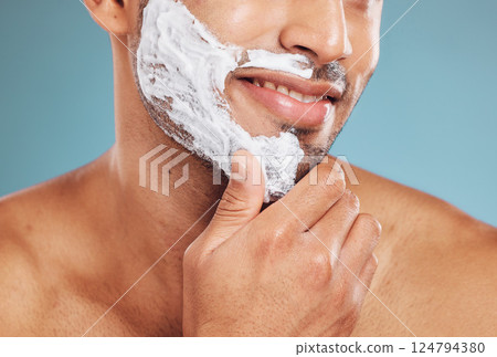 Shaving cream, cleaning and foam with man for beauty, health and wellness mockup on blue studio background. Male happy about skincare facial for clean and healthy skin with hair removal and self care Shaving cream, cleaning and foam with man for beauty, health and wellness mockup on blue studio background. Male happy about skincare facial for clean and healthy skin with hair removal and self care 124794380