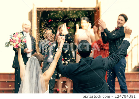 Wedding, applause and couple holding hands in celebration with support from clapping guests, friends and family. Back view, bride and groom celebrate trust, hope and success in love at a social event Wedding, applause and couple holding hands in celebration with support from clapping guests, friends and family. Back view, bride and groom celebrate trust, hope and success in love at a social event 124794381