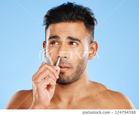 Nose hair grooming, tweezers and man beauty routine of a model from Spain doing skin and face care. Skincare, wellness and treatment of a person doing cometic hygiene, dermatology and cosmetic trim 124794398