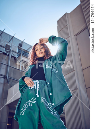 Fashion, woman and street style in urban city and gen z youth in outdoor cityscape portrait. Stylish, trendy building and young model outside, cool outfit and fashionable clothes with sunshine. Fashion, woman and street style in urban city and gen z youth in outdoor cityscape portrait. Stylish, trendy building and young model outside, cool outfit and fashionable clothes with sunshine. 124794454