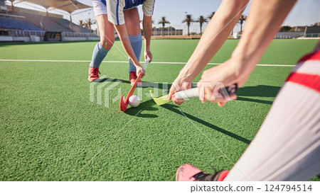 Sports game, field hockey and women challenge for ball in dynamic club competition, workout performance or practice match. Fitness exercise, training action and athlete battle tackle on stadium turf 124794514