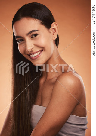 Beauty, skincare and portrait of a woman with a smile in a studio with a natural face routine. Happy, cosmetics and young model from Brazil with facial or skin treatment isolated by orange background 124794636