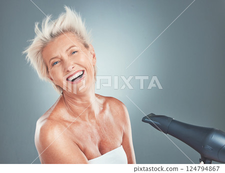 Hair care, happy and senior woman with a dryer for beauty, treatment and happiness against a grey mockup studio background. Cosmetic, smile and portrait of an elderly person with a hairdryer for hair Hair care, happy and senior woman with a dryer for beauty, treatment and happiness against a grey mockup studio background. Cosmetic, smile and portrait of an elderly person with a hairdryer for hair 124794867