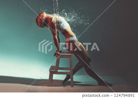 Water, sexy and chair with a woman in studio or on stage during a theatre show for entertainment. Splash, performance and wet with an attractive young female on a color background for theater Water, sexy and chair with a woman in studio or on stage during a theatre show for entertainment. Splash, performance and wet with an attractive young female on a color background for theater 124794891