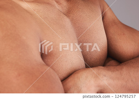 Chest, man body and bodybuilder with crossed arms being bare, confident and flex biceps. Closeup, health male and muscular trainer, fitness and show pecs after workout, gym session and powerful. 124795257
