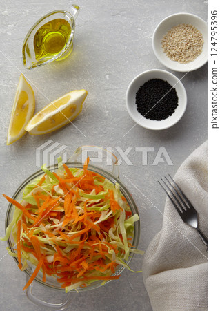 summer cabbage and carrot salad with sesame and caraway seeds with lemon and olive oil summer cabbage and carrot salad with sesame and caraway seeds with lemon and olive oil 124795396