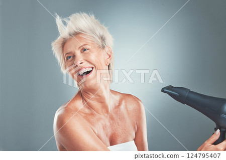 Hair, hairdryer and senior woman in studio for beauty, stylish and hair care on grey background mockup. Grey hair, mature woman and elderly woman wellness model dry hair, happy, relax and having fun Hair, hairdryer and senior woman in studio for beauty, stylish and hair care on grey background mockup. Grey hair, mature woman and elderly woman wellness model dry hair, happy, relax and having fun 124795407