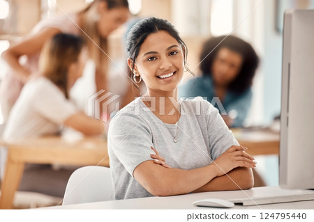 Computer, learning and education with a woman student sitting at a desk in the classroom for study or development. Portrait, university and scholarship with a young female college pupil in class 124795440