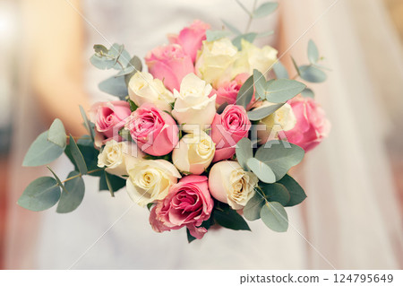 Bouquet, wedding and bride marriage celebration with natural roses, flowers and leaves zoom. Engagement, blossom and beautiful floral rose arrangement for elegant day of bridal woman. Bouquet, wedding and bride marriage celebration with natural roses, flowers and leaves zoom. Engagement, blossom and beautiful floral rose arrangement for elegant day of bridal woman. 124795649