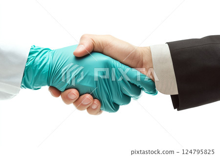 A gloved hand and an ungloved hand shake against a white background. Concept of cooperation and safety. For health and business publications. A gloved hand and an ungloved hand shake against a white background. Concept of cooperation and safety. For health and business publications. 124795825