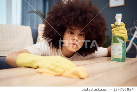 Cleaning, housework and detergent with a black woman washing a table or wooden surface as a cleaner in a home. Housekeeping, maid and chores with a young female in a house to clean furniture Cleaning, housework and detergent with a black woman washing a table or wooden surface as a cleaner in a home. Housekeeping, maid and chores with a young female in a house to clean furniture 124795984