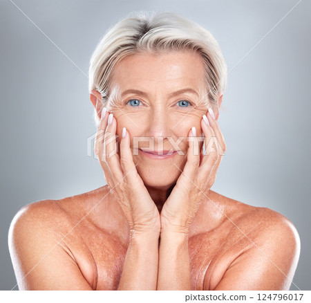 Skincare, beauty and face of a senior woman with wellness, health and smile against a grey studio background. Relax, dermatology and happy elderly person in retirement with cosmetology to relax 124796017