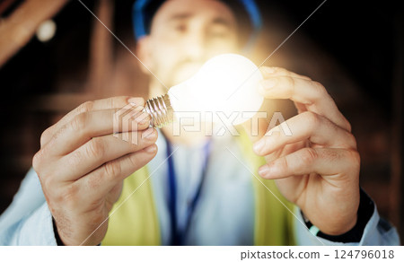 Idea, light and man engineer holding a lightbulb for vision, innovation and construction. Contractor, construction worker and designer lights for a maintenance project with an architect and bulb 124796018