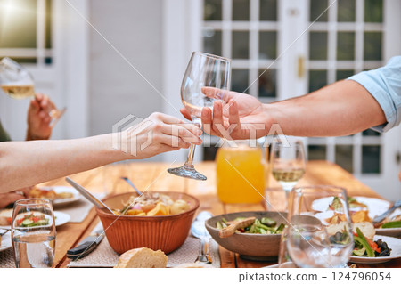 Wine glass, food and outdoor lunch of a man and woman hand ready for wine and eating. People couple hands help at the table for thanksgiving with alcohol drink and friends on a home patio in summer 124796054