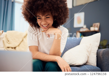 Black woman in living room, laptop and video call, download movies and online show, relax and sofa lounge. Happy young african blogger, influencer and female with afro, technology and media on couch 124796138