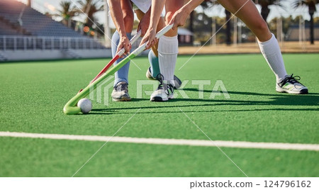Hockey, field and athletes playing a game at a championship or sports training at an outdoor stadium. Fitness, action and team with sticks and a ball doing a exercise or skill on a sport turf court. 124796162