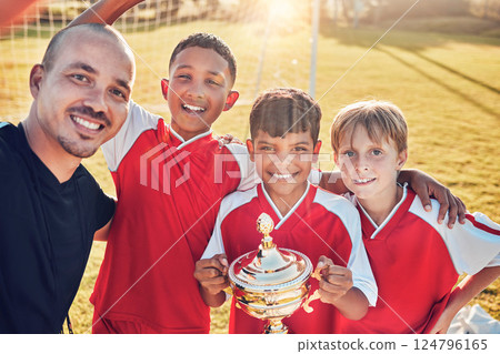 Soccer, football team and coach winning trophy from competition game with passion, motivation and teamwork. Sport collaboration achievement, group celebration with sports mentor and victory together 124796165