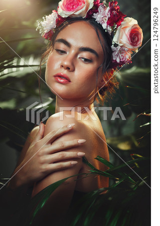 Woman, beauty and flower headband in forest for cosmetic skincare treatment. Young model, healthy natural skin glow and wellness bodycare in tropical plant rainforest outdoors with rose floral crown 124796249